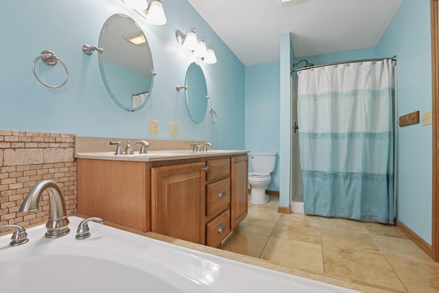 bathroom featuring vanity, tile patterned flooring, toilet, and walk in shower