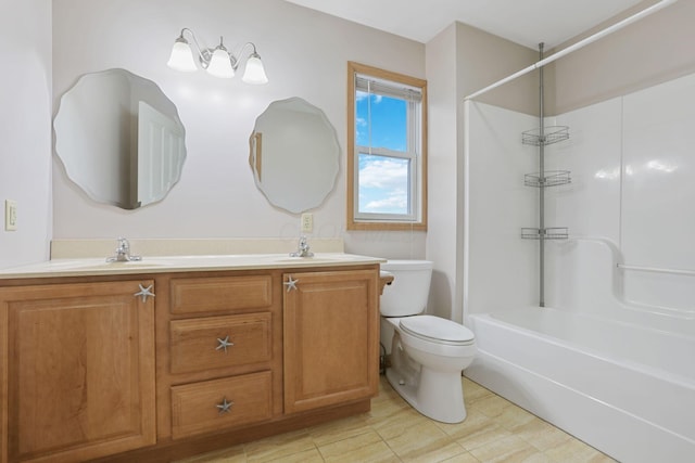 full bathroom featuring vanity, toilet, and  shower combination