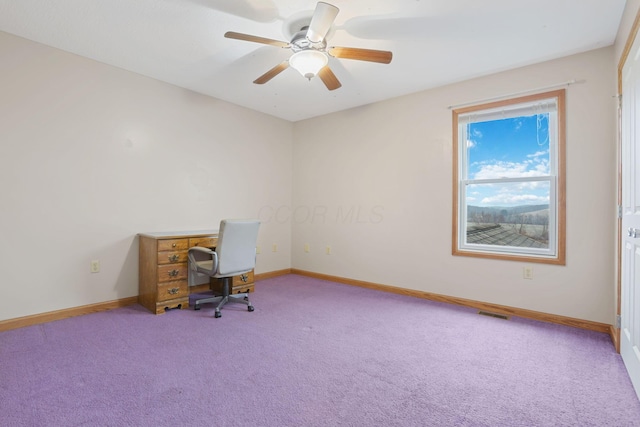 carpeted office with ceiling fan