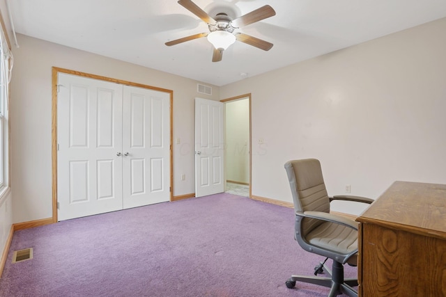 office featuring light carpet and ceiling fan