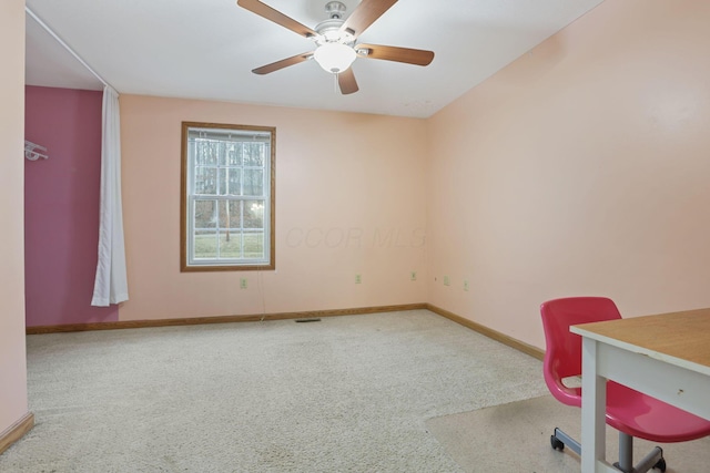 unfurnished office with carpet floors and ceiling fan