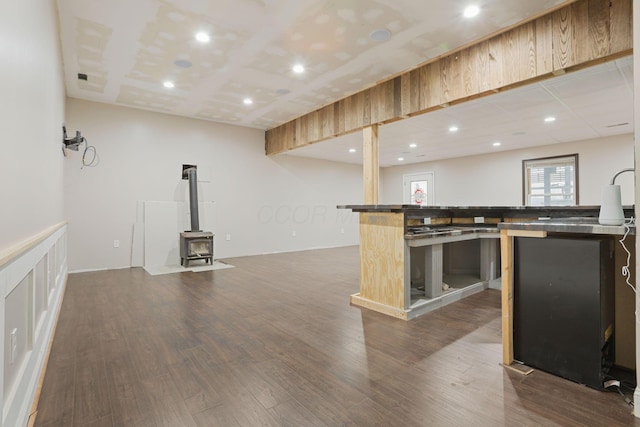 kitchen featuring a wood stove and hardwood / wood-style floors