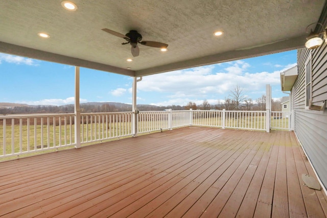 wooden deck with ceiling fan