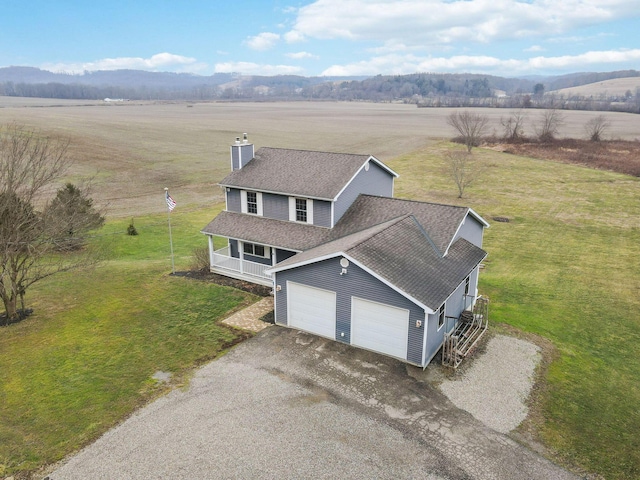 bird's eye view with a rural view and a mountain view