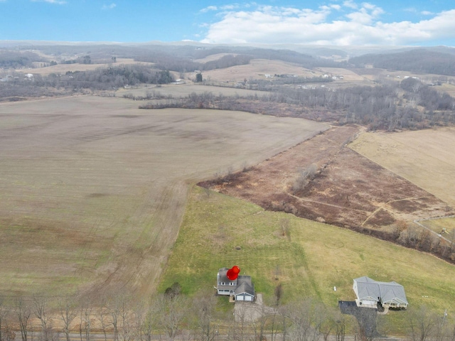 drone / aerial view with a mountain view and a rural view