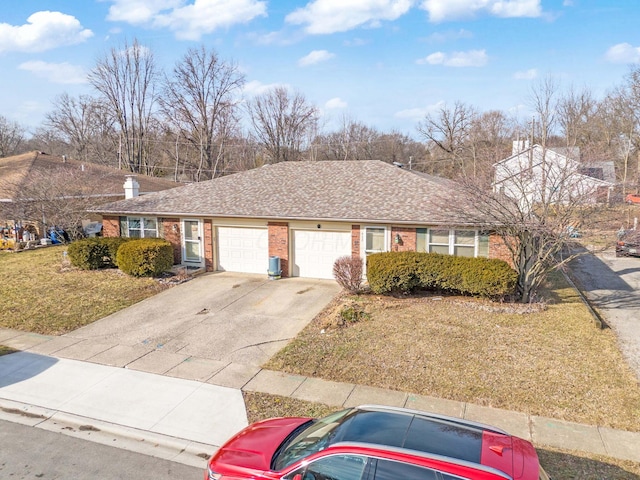 single story home featuring a garage and a front yard