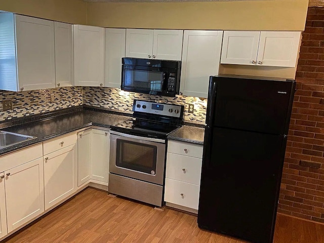 kitchen with sink, light hardwood / wood-style flooring, backsplash, black appliances, and white cabinets