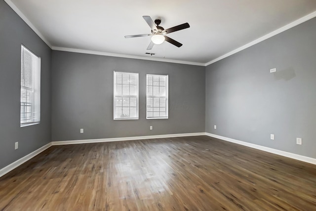 empty room with a ceiling fan, crown molding, baseboards, and dark wood-style flooring