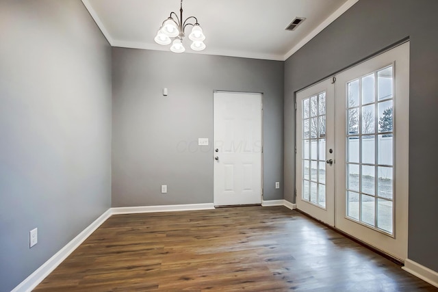 doorway to outside with visible vents, dark wood-type flooring, french doors, crown molding, and baseboards