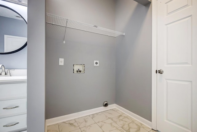 laundry area featuring baseboards, laundry area, electric dryer hookup, a sink, and marble finish floor