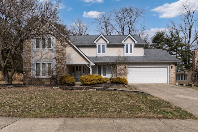 traditional-style house with an attached garage, brick siding, concrete driveway, roof with shingles, and stucco siding