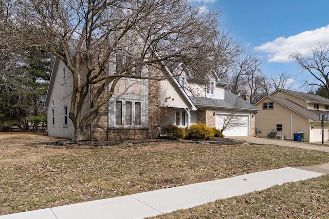 view of front facade featuring concrete driveway and brick siding