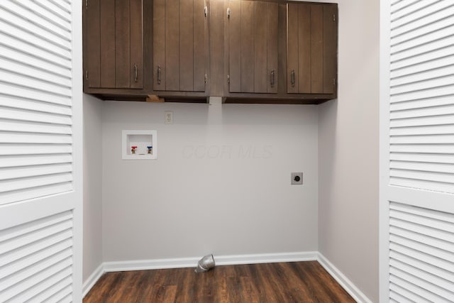 clothes washing area with washer hookup, cabinet space, electric dryer hookup, and baseboards