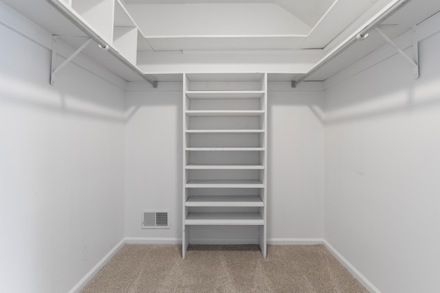 walk in closet with carpet floors and visible vents