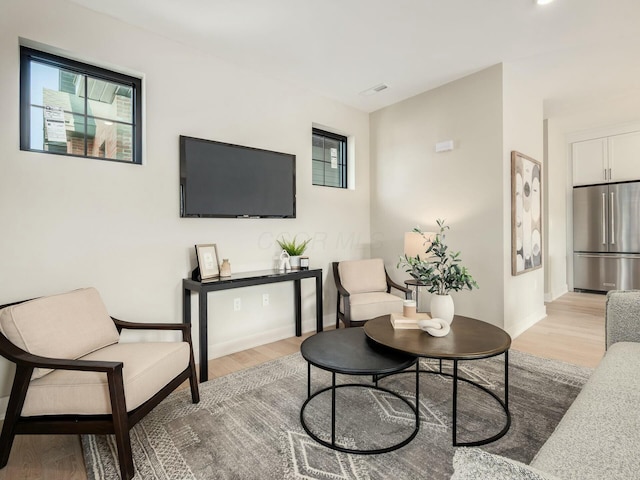 living room with light hardwood / wood-style floors