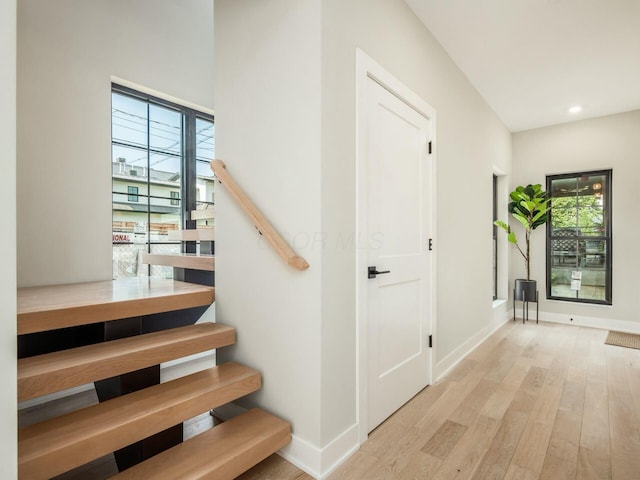 stairs featuring wood-type flooring