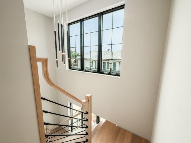 stairway featuring wood-type flooring