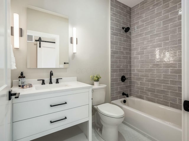 full bathroom featuring vanity, tiled shower / bath combo, and toilet