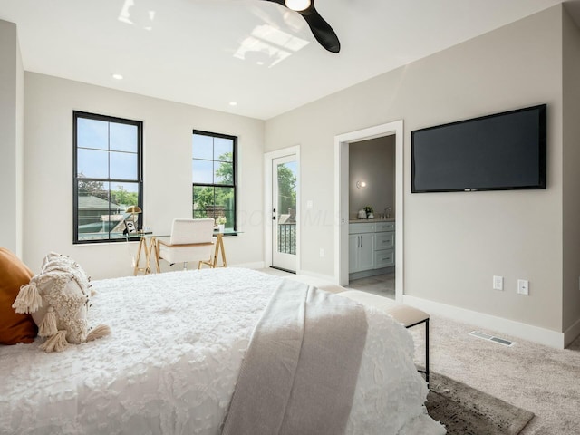 bedroom with light carpet, ensuite bath, access to outside, and ceiling fan