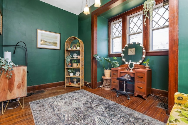 office space featuring baseboards and hardwood / wood-style flooring