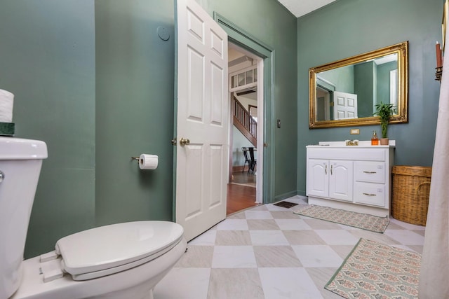 bathroom with vanity, tile patterned floors, and toilet