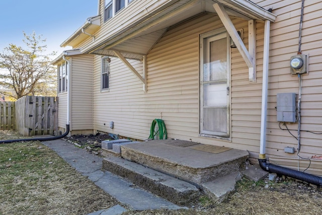 doorway to property with fence