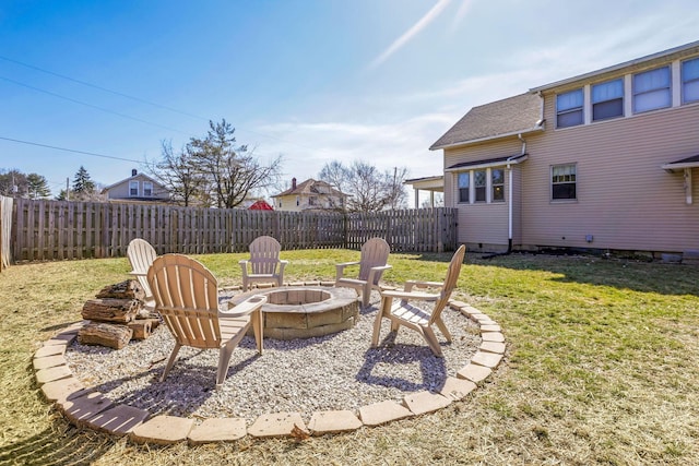 view of yard with a fire pit and fence