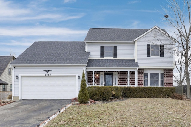 front of property featuring a garage and a front yard