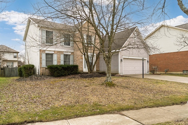 view of front of home featuring brick siding, roof with shingles, concrete driveway, and fence