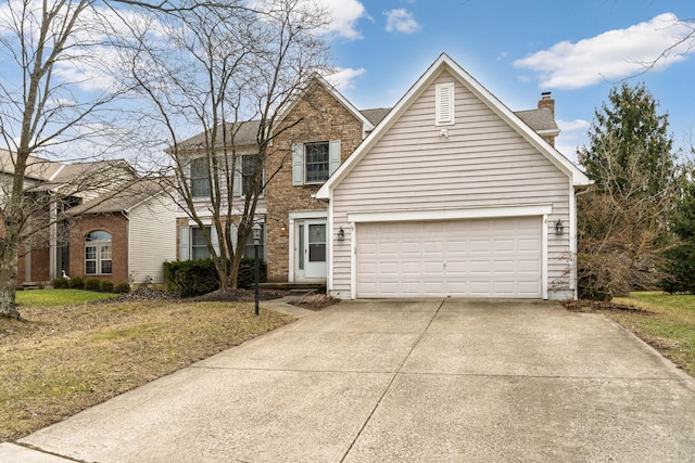 traditional home with a chimney, driveway, an attached garage, and brick siding