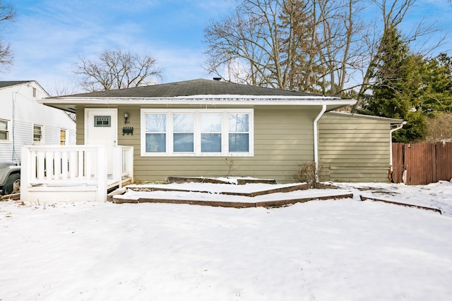 view of front of house featuring fence