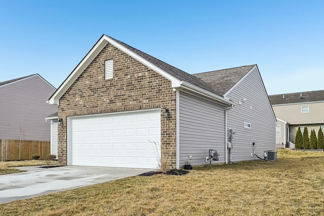 view of side of home with a garage, driveway, brick siding, and a yard