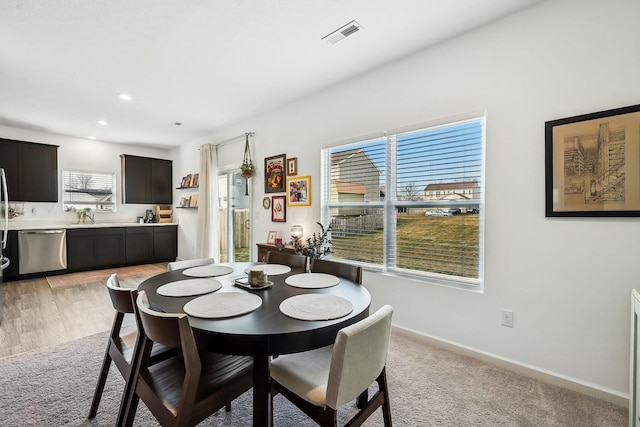 dining space with recessed lighting, visible vents, light carpet, and baseboards