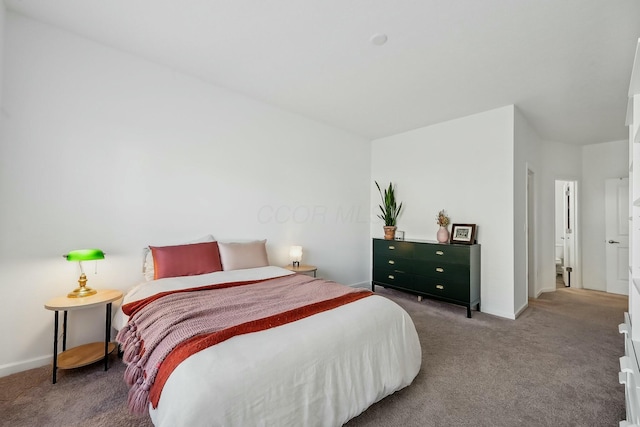 carpeted bedroom with baseboards