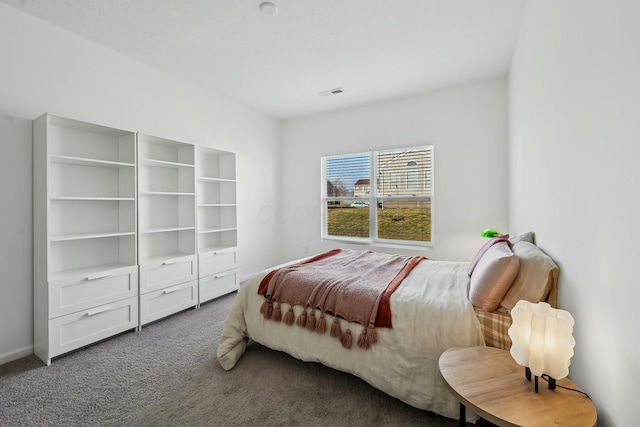 bedroom featuring carpet floors and visible vents