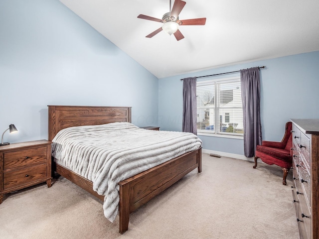 bedroom with lofted ceiling, light carpet, and ceiling fan