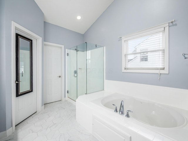 bathroom featuring independent shower and bath, vaulted ceiling, and tile patterned floors