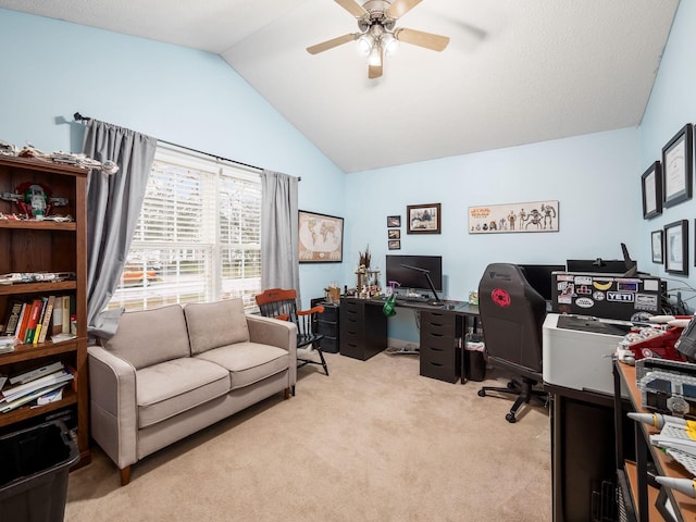 office space with ceiling fan, light colored carpet, and vaulted ceiling