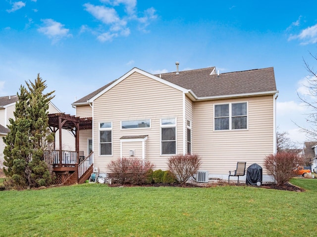 back of property featuring central AC unit, a yard, and a pergola