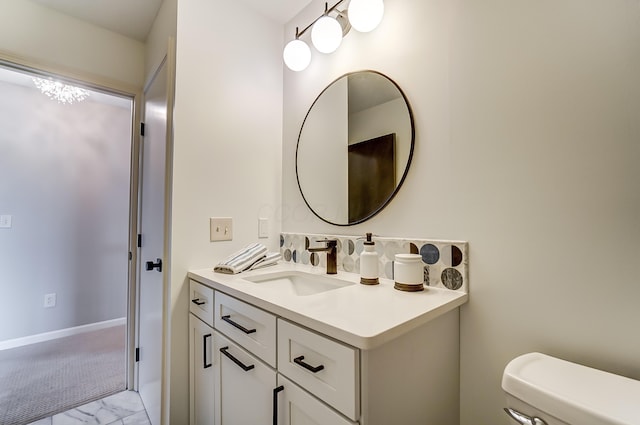 bathroom with vanity and toilet