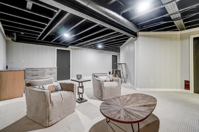 carpeted living room with sink