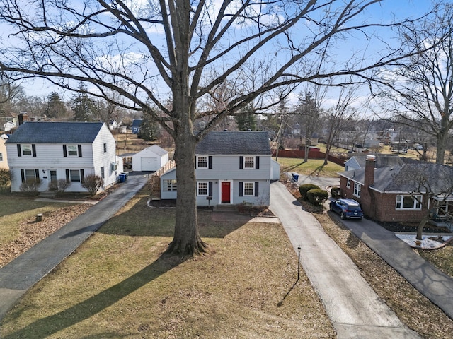 view of front of house featuring a garage and a front lawn