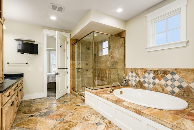 ensuite bathroom with a bath, visible vents, a shower stall, and ensuite bath