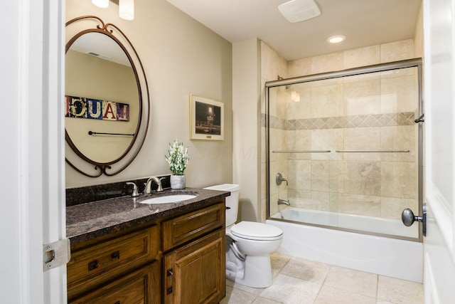 full bathroom featuring tile patterned flooring, visible vents, toilet, bathing tub / shower combination, and vanity