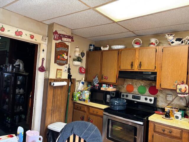 305 E Innis Ave, Columbus, OH 43207 - kitchen with tasteful backsplash, a paneled ceiling, and stainless steel range with electric stovetop
