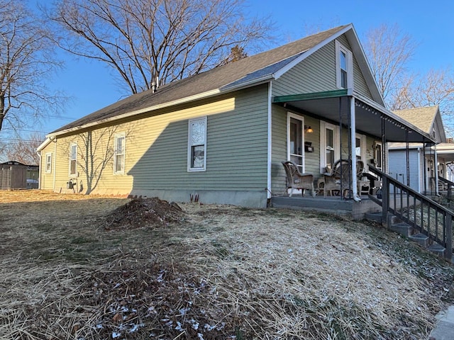 view of property exterior with covered porch