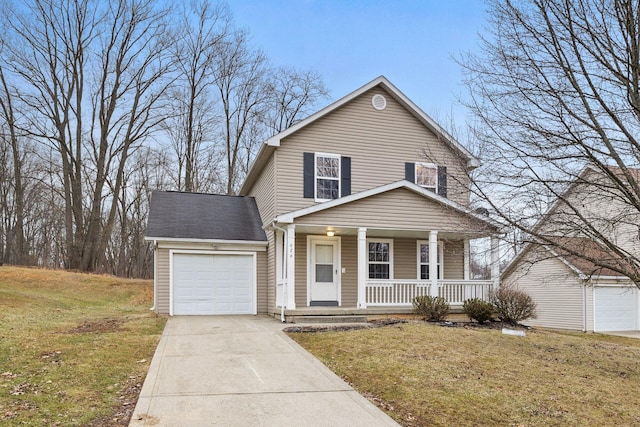 view of front property featuring a garage, a front yard, and covered porch