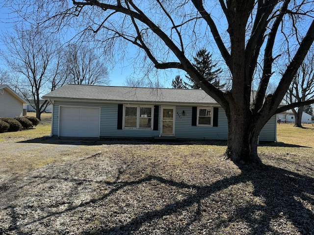 single story home with a garage and dirt driveway