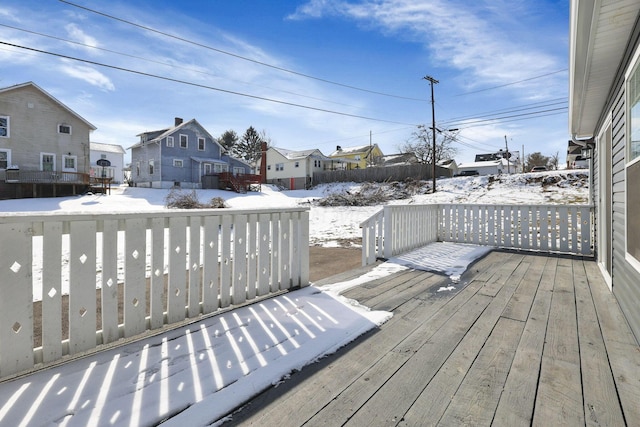 view of snow covered deck