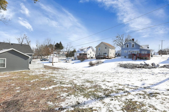 view of yard layered in snow